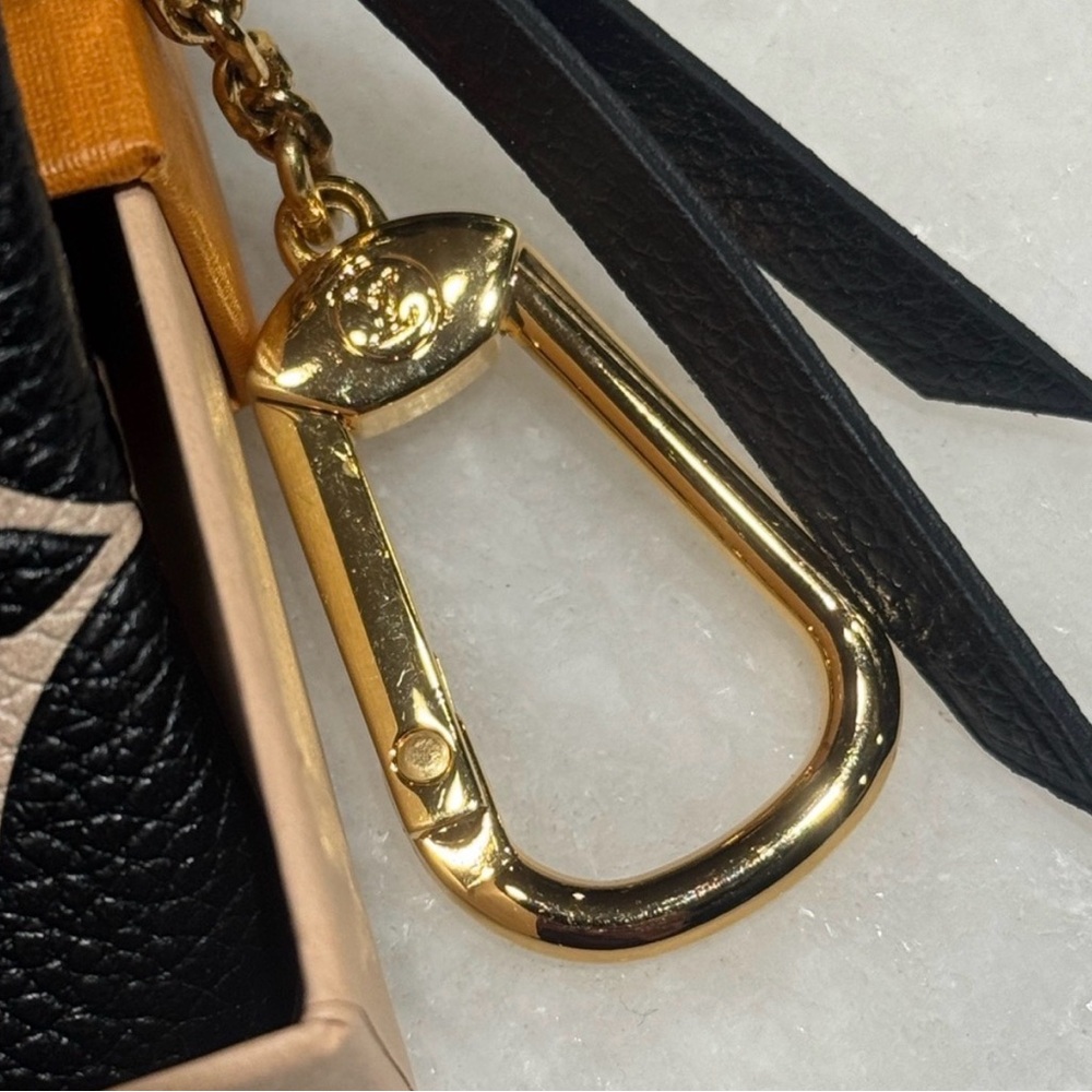 Authentic Louis Vuitton Key Pouch Cles Bicolor Empreinte Monogram Leather - Picture 4 of 10